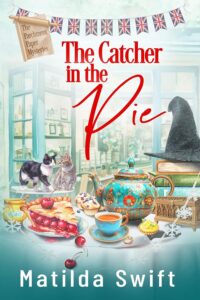 Book cover of The Catcher in the Pie by Matilda Swift, featuring tea, cherry pie, and two cats on a cozy English village background.